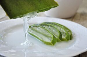 Herbal skin care brand, Fresh aloe vera gel dripping from leaf