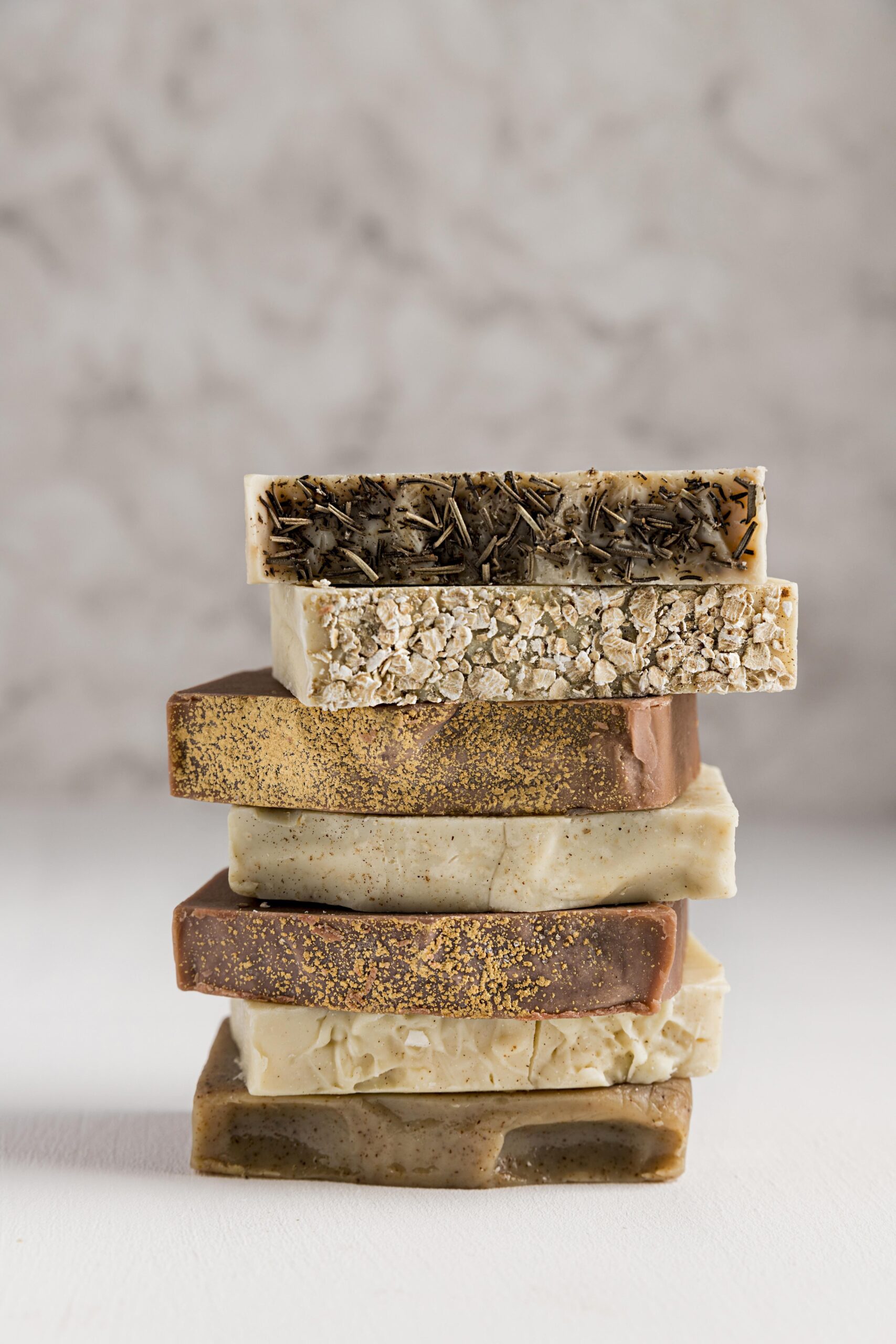 Stack of natural herbal soap bars made with organic ingredients